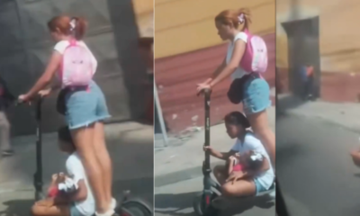 Indignación en Barranquilla por mujer que transporta a dos niños en una patineta eléctrica sobre la calle 30: 'que irresponsabilidad, que peligro'