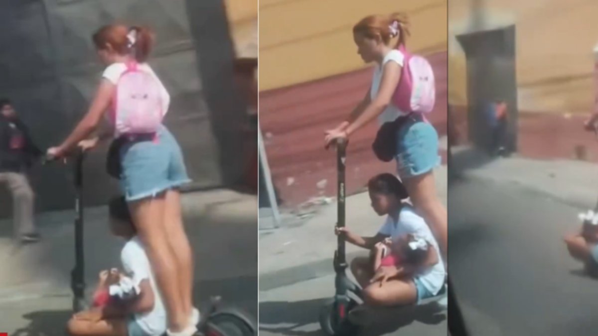 Indignación en Barranquilla por mujer que transporta a dos niños en una patineta eléctrica sobre la calle 30: 'que irresponsabilidad, que peligro'