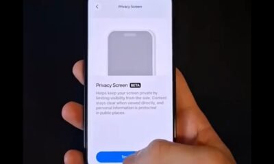 Persona sosteniendo un teléfono mostrando pantalla de privacidad en modo beta, con ajustes de seguridad.